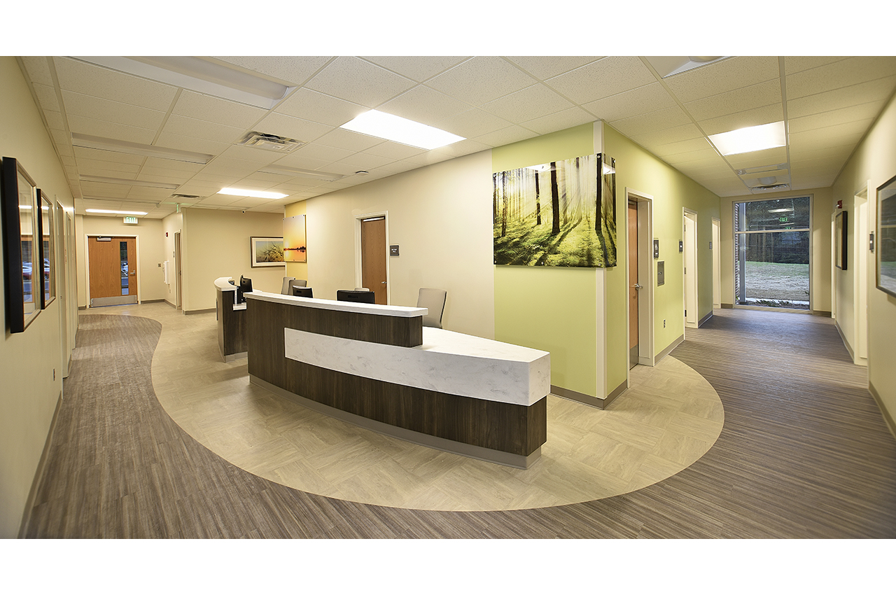 total healthcare nurse station at russell medical center which provides colorful wayfinding via photography