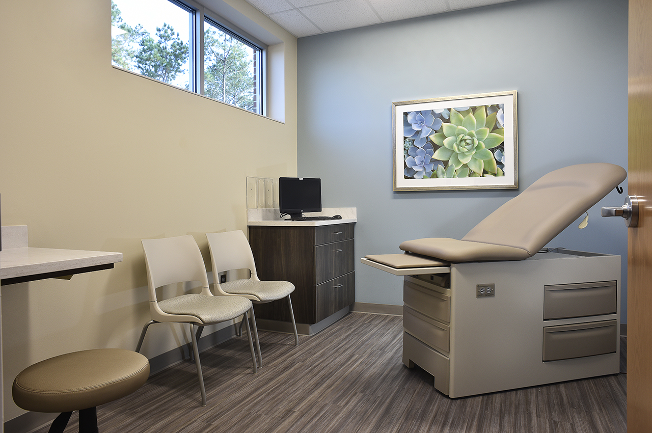 total healthcare exam room at russell medical center with calming blue accents view to outdoors
